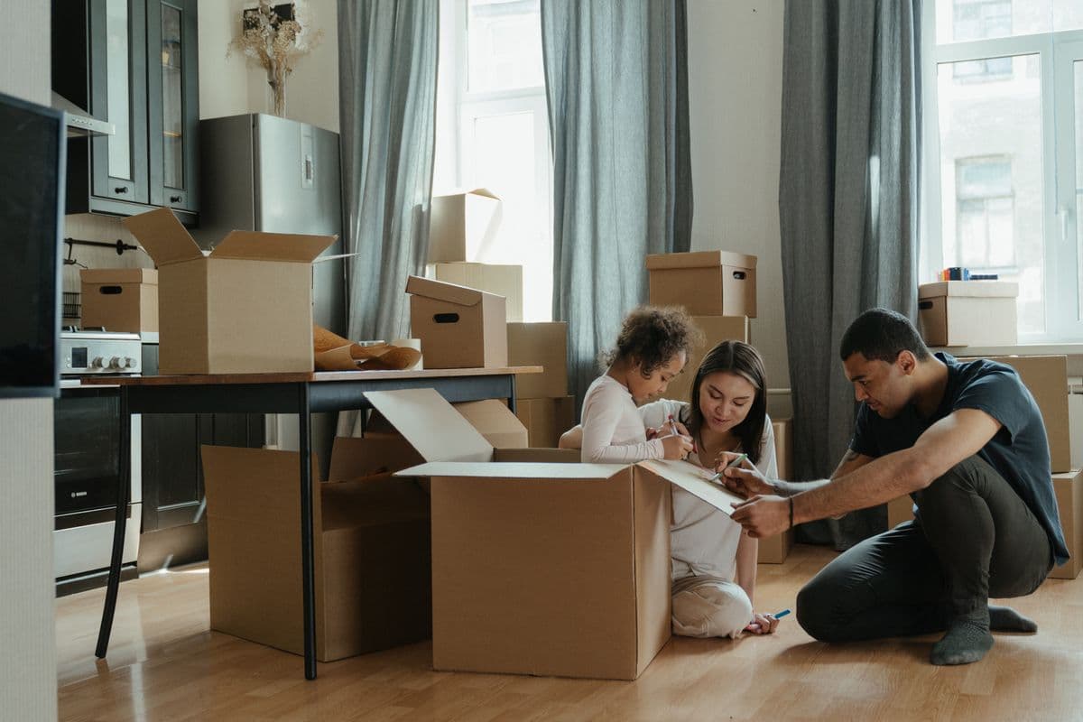 Family organizing boxes during a move near Abingdon, Virginia